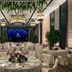 The St. Regis Hong Kong ballroom set for a banquet with round tables, chandeliers and greenery in Hong Kong