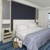 Real Marina Hotel & Spa in Olhão: bedroom with balcony sea view and striped carpet