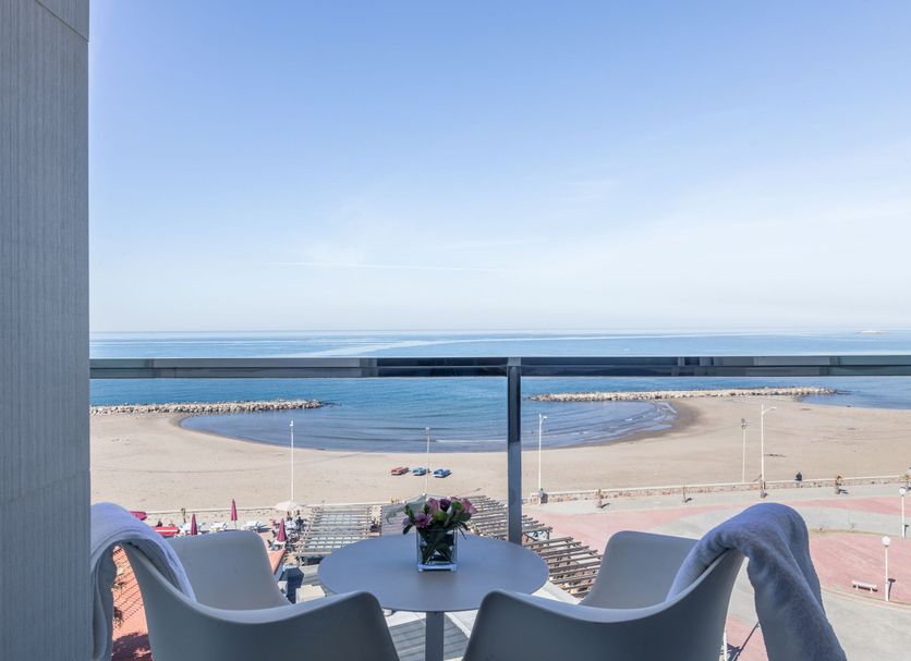 AZ Hotel Vague D'or in Algiers balcony with table, chairs and sea view over a sandy beach