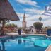 Hotel Posada del Hidalgo by Balderrama Hotel Collection in El Fuerte with a pool and church tower view