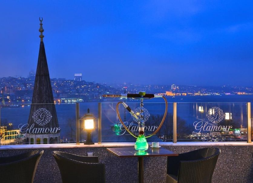 Glamour Hotel Istanbul Sirkeci rooftop terrace with Istanbul skyline and Bosphorus view at dusk