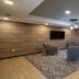 Candlewood Suites Baytown By IHG lobby seating area with TV and patterned rug in Baytown