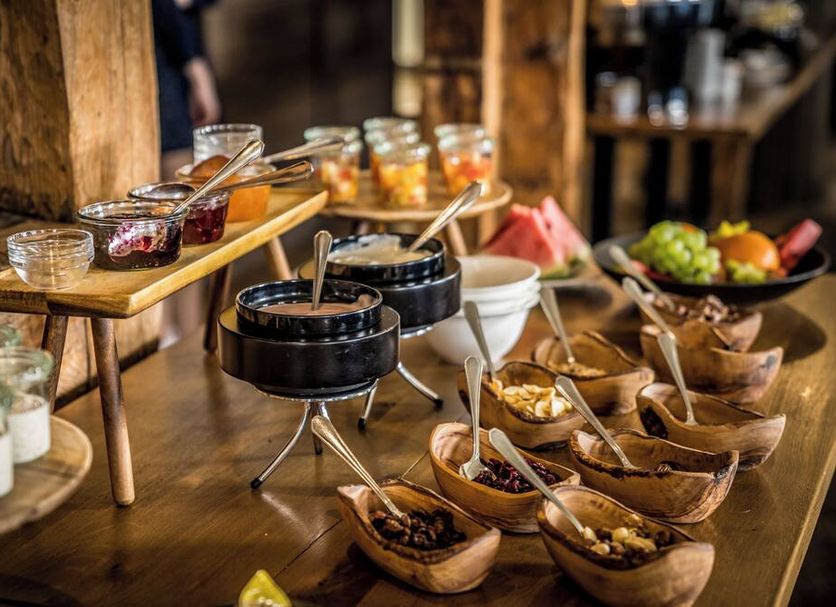Breakfast buffet at Hotel Hofgut Hohenkarpfen in Hausen ob Verena with bowls, fruit and jams