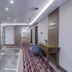 Nearport Hotel Sabiha Gokcen Airport hallway with elevator, seating and patterned carpet in Istanbul