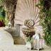 Casa Schuck Boutique Hotel in San Miguel de Allende courtyard with shell fountain, lanterns and greenery