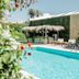 Atlántico Boutique Hotel in Punta del Este with outdoor pool, thatched swim-up bar and lounge chairs