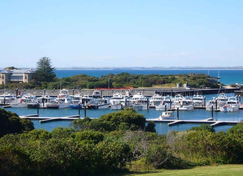 Harbour View Motel in Robe overlooking a marina with boats, water, and coastal greenery