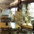Albergue Rural Cal Picarol in Àger dining room with stone walls, wooden tables and rustic seating