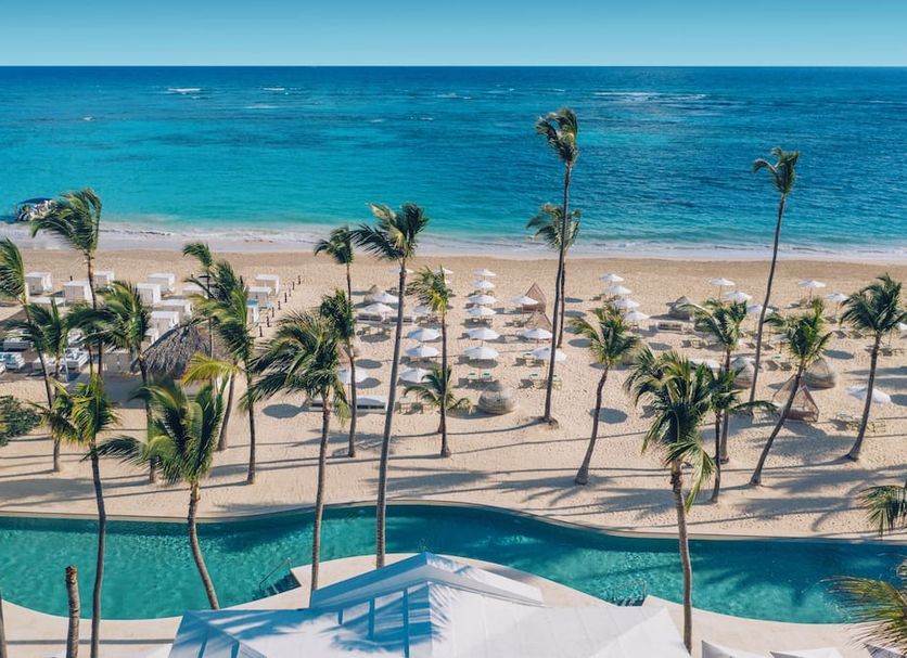 Iberostar Selection Coral Bávaro in Punta Cana with beachfront pool, palm trees, and turquoise ocean