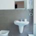 Sfumature Partenopee Naples bathroom with bidet, wall-mounted sink, mirror, and towel dryer