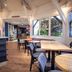 ibis Nogent-sur-Marne lobby with seating area, wooden tables and large windows in Nogent-sur-Marne