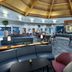 Delta Hotels by Marriott Waltham Abbey lounge with curved ceiling, seating area and bar