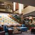 Residence Inn by Marriott Los Angeles Pasadena/Old Town lobby with seating, staircase and fireplace in Pasadena