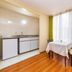 Capital O Hotel Suites Marne, Mexico City room with kitchenette, dining table and large window