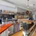 Countryman Motor Inn in Dubbo lobby bar with marble-front counter, wood floors and seating