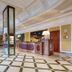 Borgo Palace Hotel in Sansepolcro lobby with marble floor, ornate ceiling, reception desk and seating area