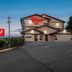 Red Roof Inn Bristol exterior at dusk with illuminated signage and parking lot