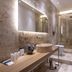 Relais Villa Grazianella Una Esperienze bathroom with walk-in glass shower, freestanding tub and wood vanity in Acquaviva