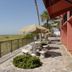 Gulf Towers Resort Motel in Indian Rocks Beach with patio tables, umbrella shade, and beach access view