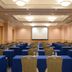 JR Hotel Clement Takamatsu meeting room with rows of blue-covered tables and chairs
