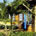 Pousada Paço do Lavradio in São João del Rei with a hammock, palm trees, and lush garden courtyard