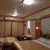 Sin Fu Business Hotel, Taichung City: twin beds in a simple guest room with floral wall art