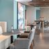 Holiday Inn Express Pensacola Beach by IHG dining area with tables, chairs, and ocean-view windows