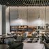 Rivertain Hotel Daegu lounge with tables, chairs, and large windows overlooking the street