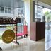 Horison Hotel Sukabumi lobby with bell cart, glass entry doors, and poolside view