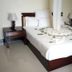 Asinuara Hotel Bahir Dar guest room with double bed, bedside tables, and seating area