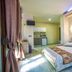 Mediterranean Holidays in Ierissós room with king bed, kitchenette, and balcony light