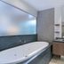 Private Sea Temple Studio 423 Palm Cove bathroom with freestanding tub, vanity and mirror