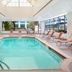 Sheraton Lincoln Harbor Hotel Weehawken indoor pool with lounge chairs and gym view