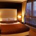 Rota Bulvar Hotel Ankara guest room with double bed, bedside lamps and large floor-to-ceiling windows