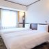 Toyoko Inn Narita Airport Honkan in Narita guest room with two twin beds and window with curtains