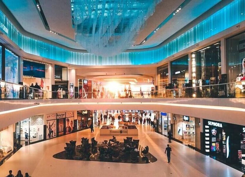 Anastazia Luxury Suites & Spa in Diónysos with a bright modern shopping mall atrium and upper-level walkway