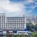 Hanting Express Hangzhou Cuiyuan Branch exterior in Hangzhou with city skyline view