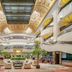 Power Valley International Hotel in Baoding lobby with chandeliers, skylit atrium, palm trees and seating