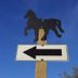 Mount Rumney Escapes - Platypus Cabin sign with horse silhouette and left arrow in Cambridge