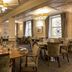 Mercure Aberdeen Ardoe House restaurant dining room in Aberdeen with set tables and chandeliers