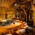 Naman Retreat Da Nang bamboo bar and lounge with curved counter and woven bamboo ceiling