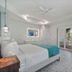 Bridgewalk, a Landmark Resort in Bradenton Beach guest room with balcony and wall-mounted TV