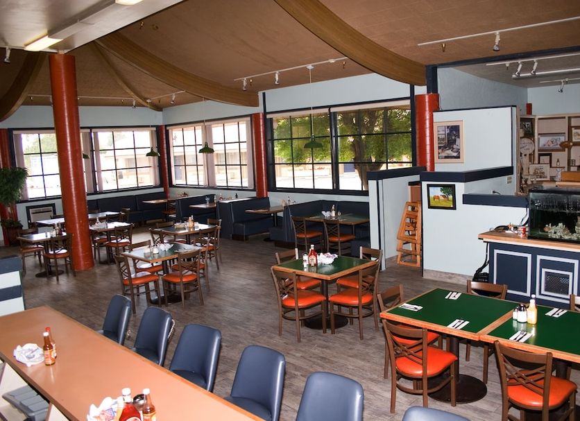 Keefer's Inn in King City dining room with tables, chairs, and a buffet counter