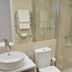 Casa De Casal De Loivos bathroom with vessel sink, toilet, glass shower and towel rack in Casal de Loivos