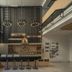 The Velo's Hotel And Bmx Pump Track lobby with bike display, front desk and lofted seating in Aranyaprathet