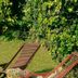 Hotel Palacio La Casona de Cerrazo in Cerrazo: two wooden lounge chairs in a garden