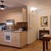 Dorf.Apart in Neustift im Stubaital with a compact kitchenette and dining table in a bright apartment room