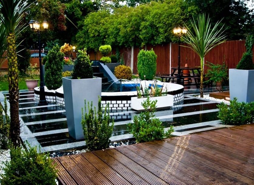 Skylark B&B in Hounslow garden terrace with water feature and wooden deck seating area