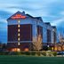 Hilton Garden Inn Hoffman Estates exterior at dusk with illuminated sign and parking lot