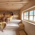 Waldhotel am Notschreipass sauna in Todtnau with two guests sitting on wooden benches